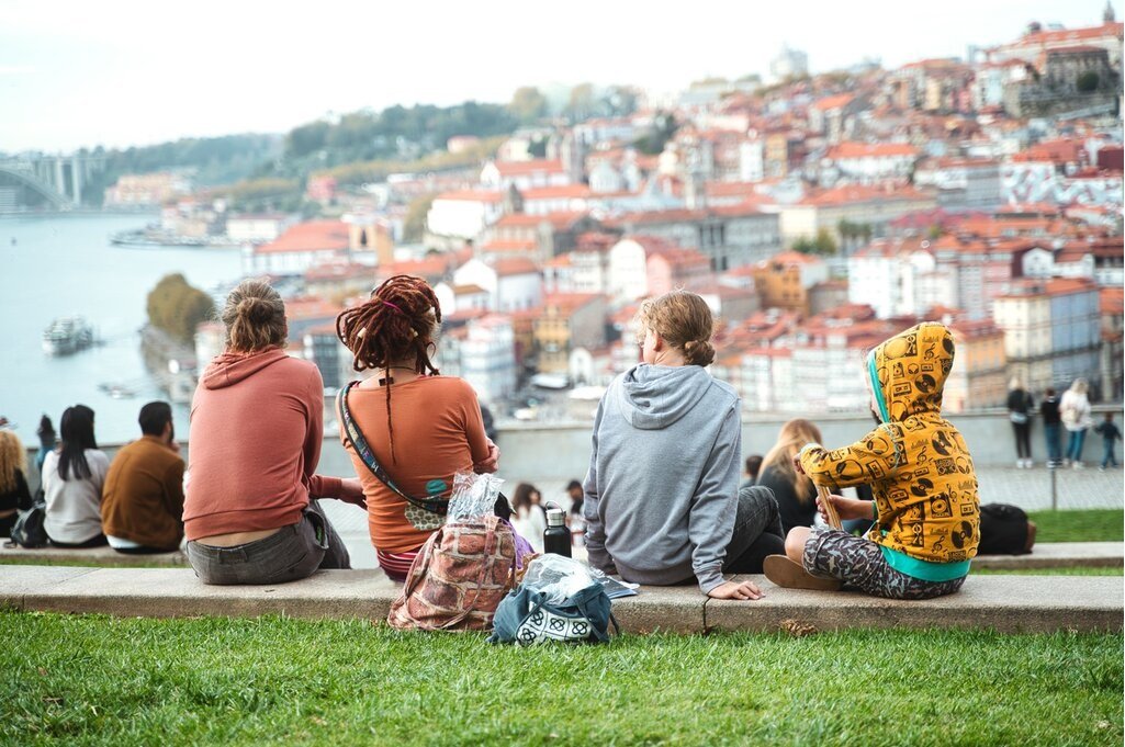 A happy family looking over the colorful city of Porto, Portugal.